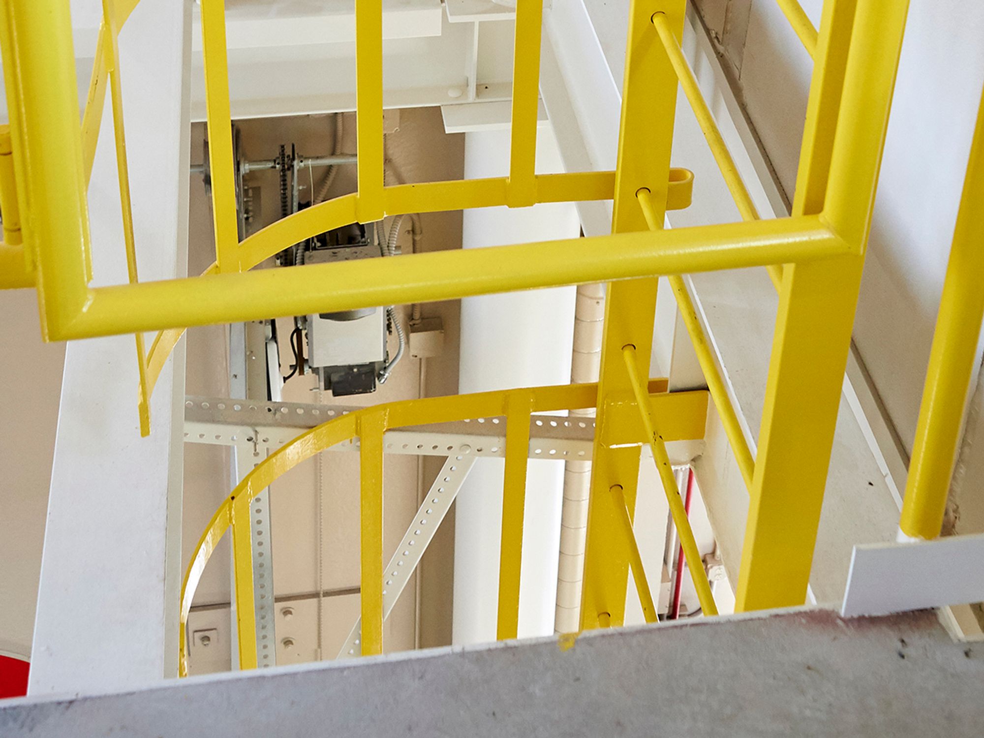 Install self-closing gates or offsets at the tops of fixed ladders