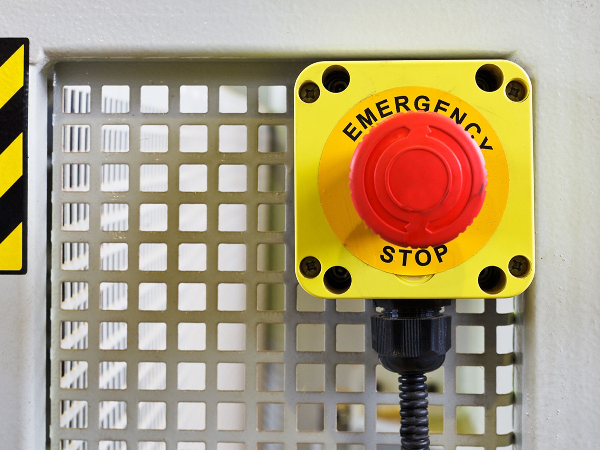 What are the OSHA requirements for emergency stop devices?