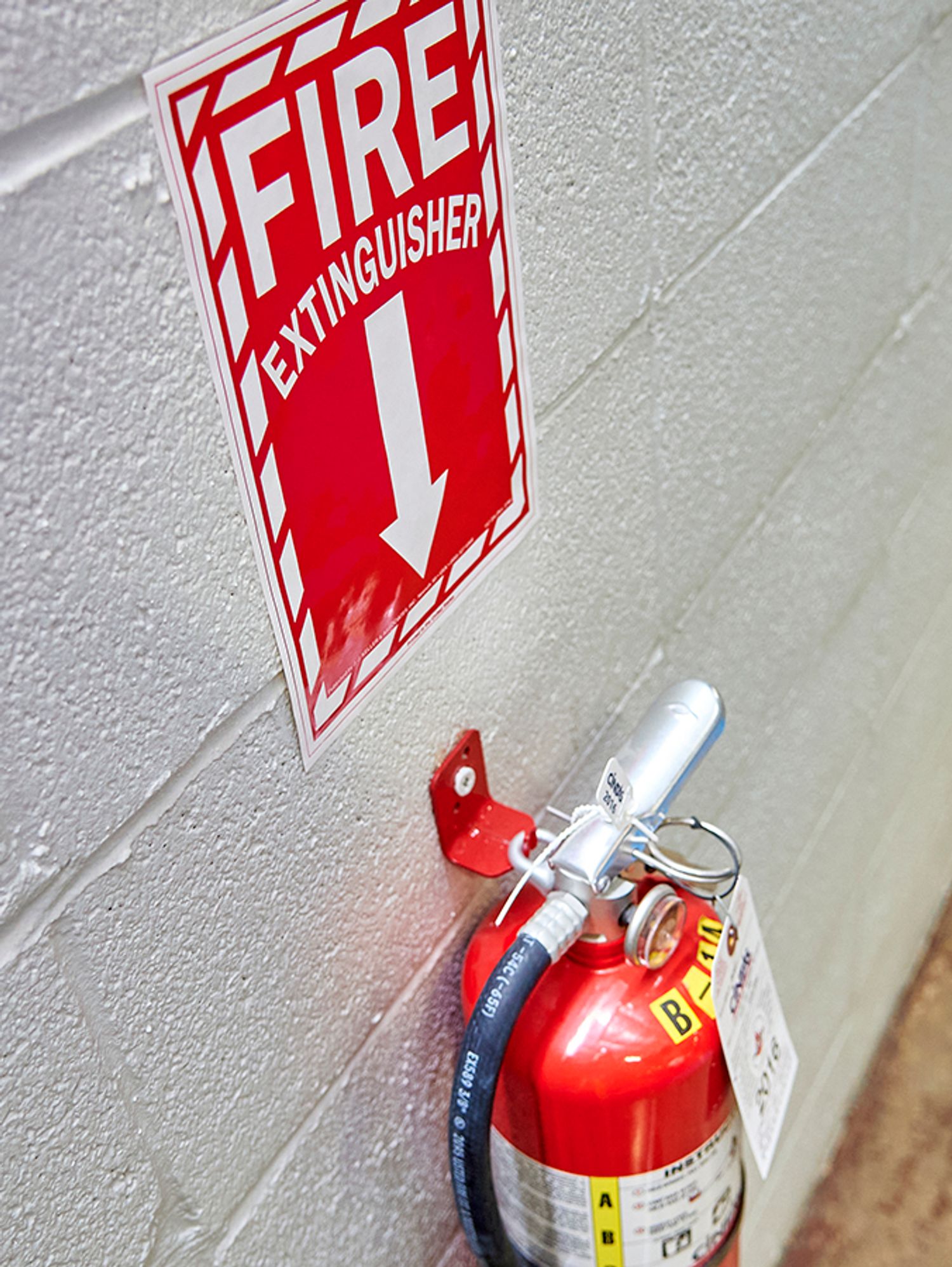 Premium Photo  Fire extinguisher cabinet mounted on the wall in