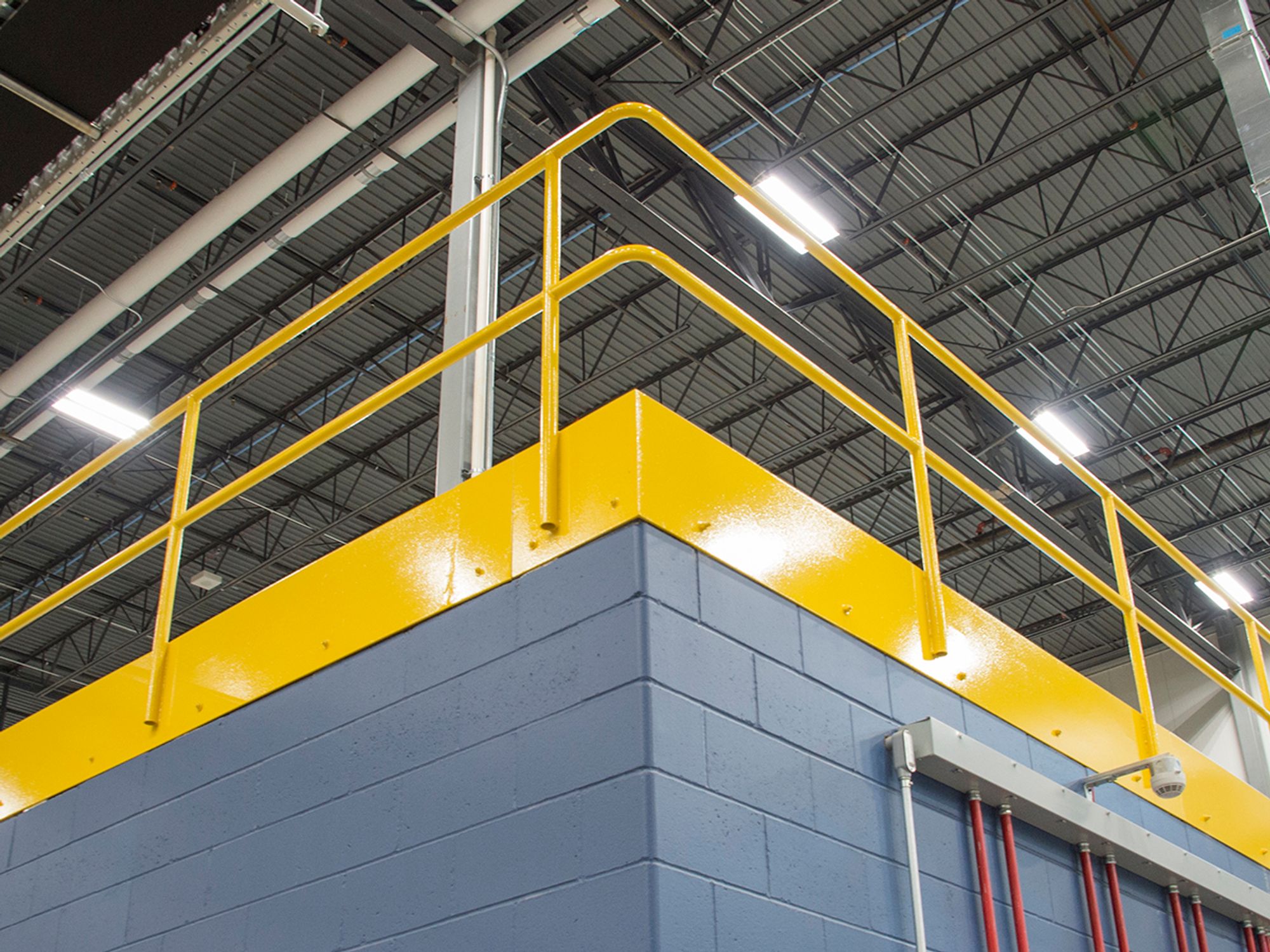 Protect workers from sides, edges, and hoist areas