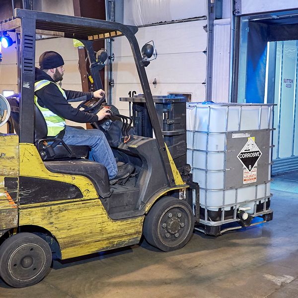 In dimly lit areas, OSHA requires auxiliary lighting on PITs