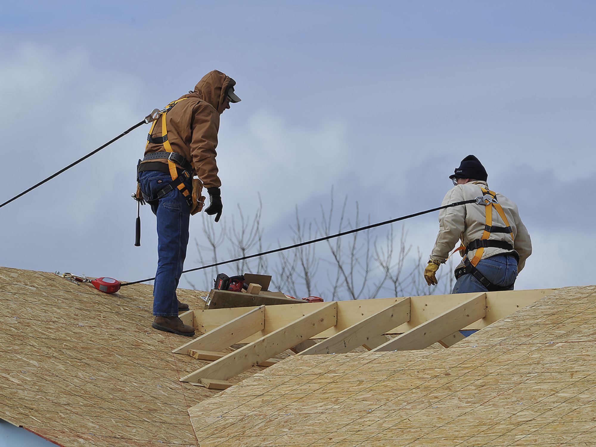 Protect workers in residential construction with guardrails, safety nets, or fall arrest systems