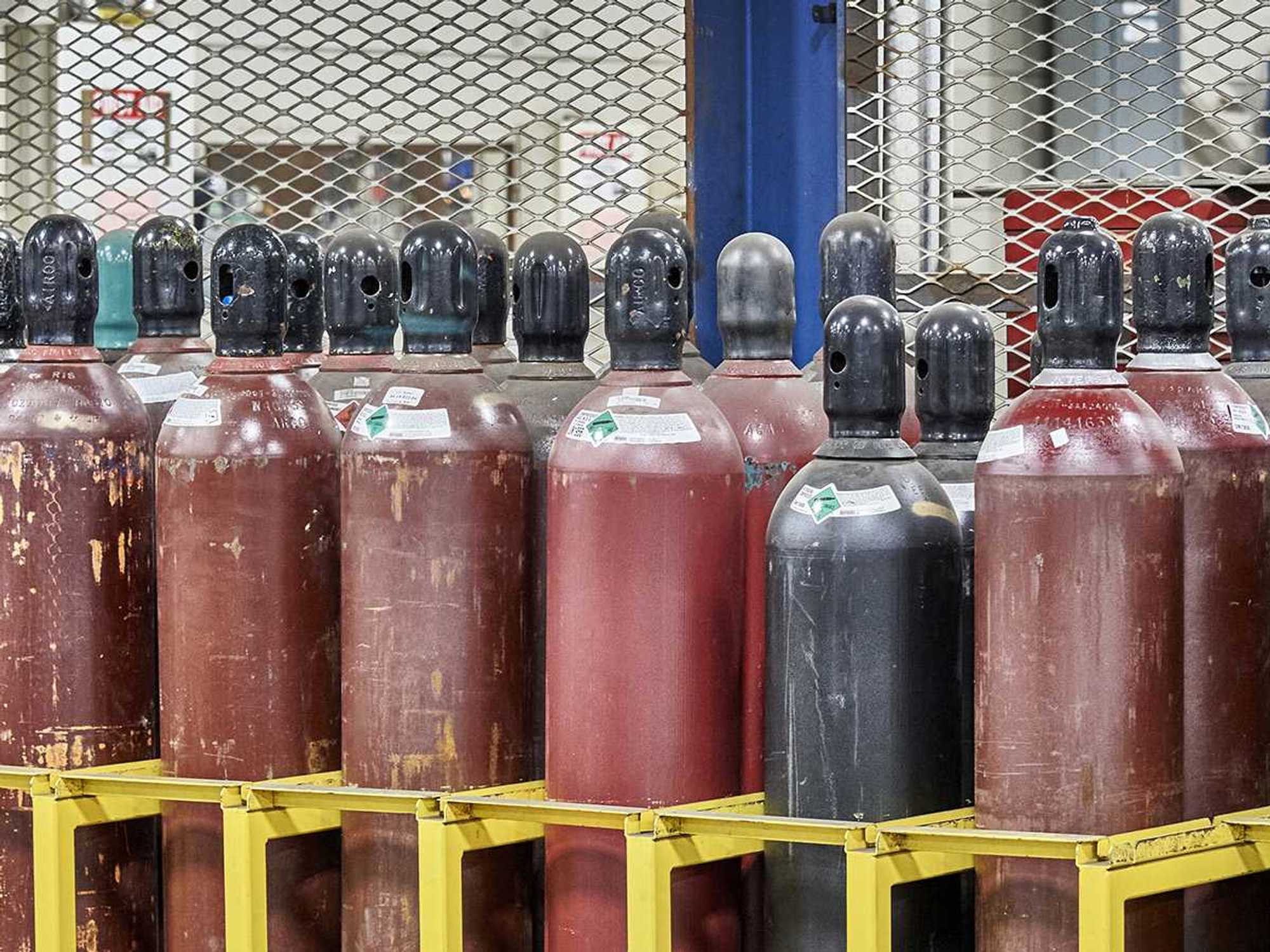 Transporting, moving, and storing compressed gas cylinders